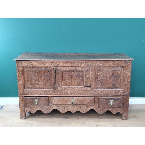 633 - An antique carved oak Mule Chest fitted two drawers 4ft 10in W x 2ft 8in H (R8)