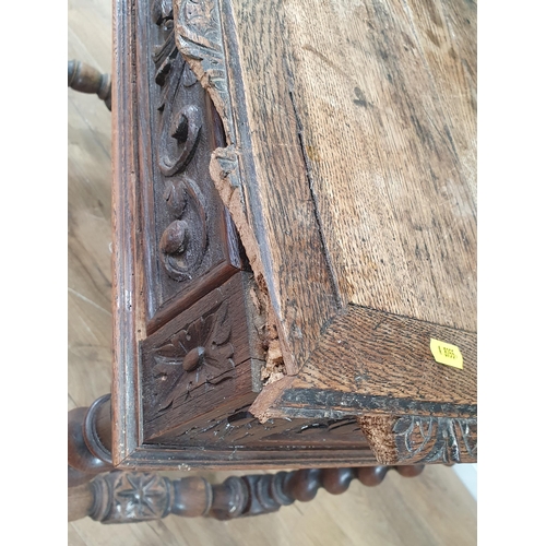 636 - A Victorian carved oak Side Table fitted single frieze drawer raised on barley twist supports united... 