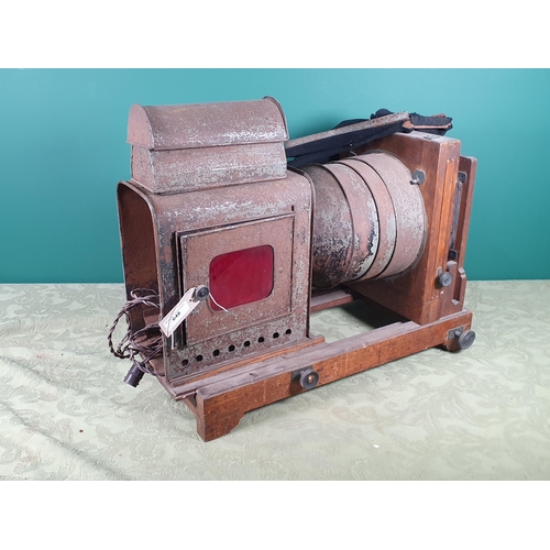 648 - A metal and oak Enlarger and a leather case containing film backs and glass photographic plates (Fai... 