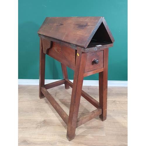 652 - An antique stained pine Saddle Horse folding out to a work table fitted drawer to each end 3ft 4in H... 