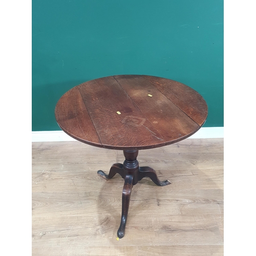 658 - An antique oak Pillar Table on barrel turned column and tripod supports (one foot chipped) A/F 2ft 6... 