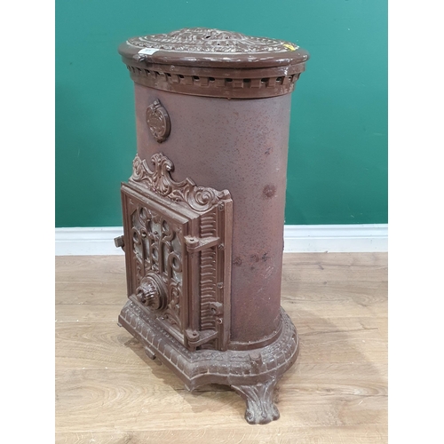 671 - A Godin brown cast iron Stove, oval with hinged cover, 2ft 7in H