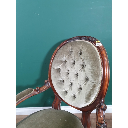 674 - A Victorian walnut framed button upholstered Armchair (R10)