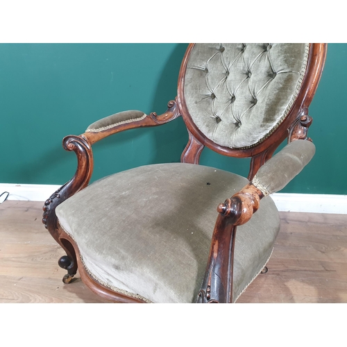 674 - A Victorian walnut framed button upholstered Armchair (R10)