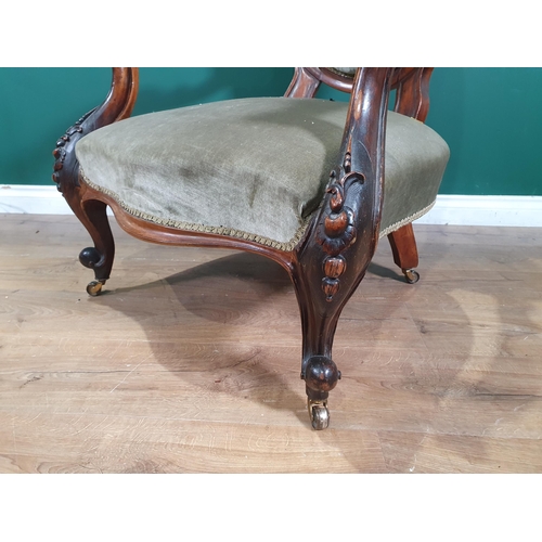 674 - A Victorian walnut framed button upholstered Armchair (R10)