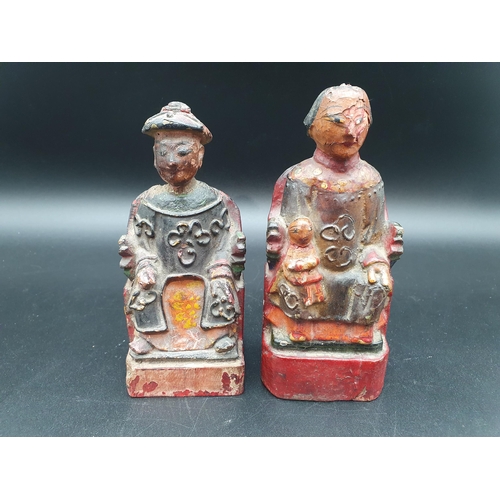 68 - A pair of Eastern carved wood and seated polychrome Figures, approx 6in