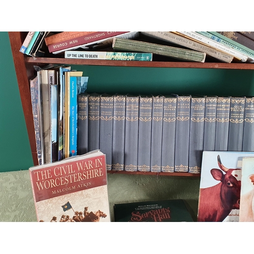 693 - An oak Bookcase/Trough, an oak Letter Rack, a pine Letter Rack and a quantity of Books (R10)