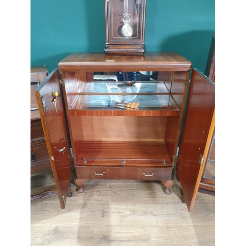 713 - An oak and lead glazed Bookcase, a walnut veneered Cocktail Cabinet, an oak Bureau and a modern Wall... 