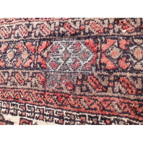 730 - A small Persian Rug with rows of medallions on a cream ground, 6ft x 3ft