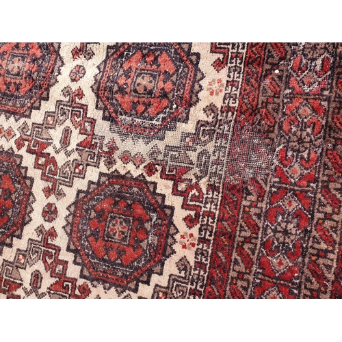 730 - A small Persian Rug with rows of medallions on a cream ground, 6ft x 3ft