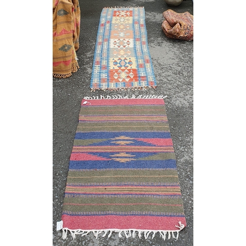 731 - A striped Mat with tasselled fringe and a similar Runner, 9ft 7in x 2ft 7in