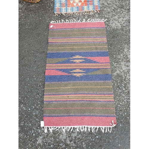 731 - A striped Mat with tasselled fringe and a similar Runner, 9ft 7in x 2ft 7in