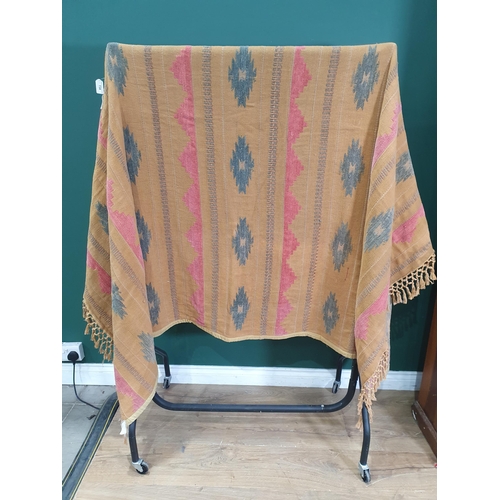 738 - A cotton Wall Hanging/Bed Throw with red and green motifs on a brown ground, 7ft 7in x 5ft 7in