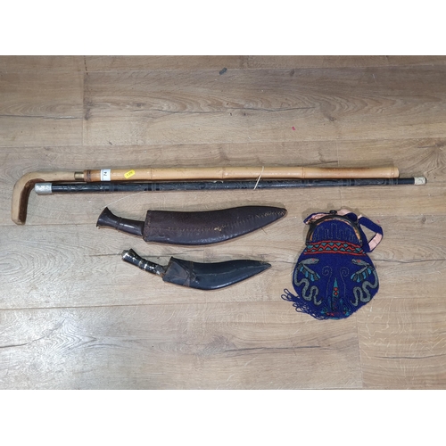 74 - Two Kukris, a Walking Stick, antique bamboo Sword Stick and a bead work Purse (R3)