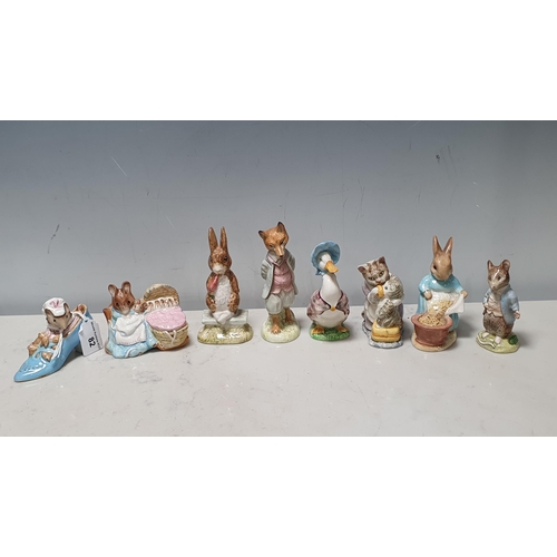 82 - Eight Beswick Beatrix Potter Figures including 'The Old Woman who lived in a Shoe', 'Hinca Munca', '... 