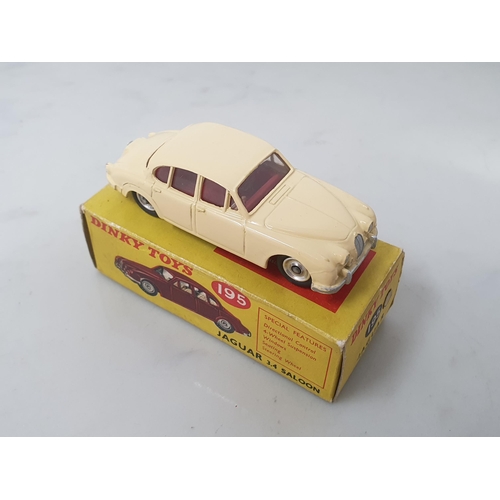 124 - A boxed Dinky Toys No.195 cream Jaguar 3.4L Saloon