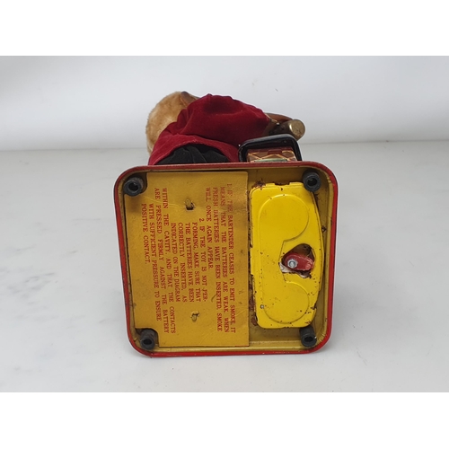 198 - A battery operated rubberised and tinplate Bartender automaton