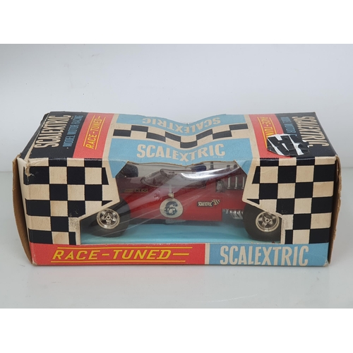 258 - A boxed Scalextric Lotus Indianapolis GP, a boxed C/9 Ferrari GP (box A/F), three damaged Racing Car... 