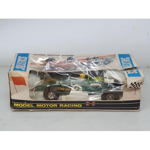 258 - A boxed Scalextric Lotus Indianapolis GP, a boxed C/9 Ferrari GP (box A/F), three damaged Racing Car... 