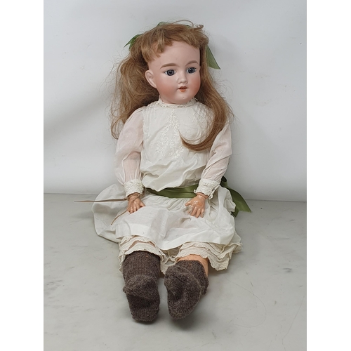 302 - An Armand Marseille 390 Girl Doll with blonde hair and fixed eyes 24in