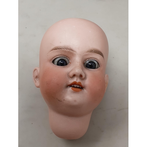 305 - A 1950's Doll, an Armand Marseille 390 Doll's Head with sleepy eyes 2 1/2in D and an Armand Marseill... 