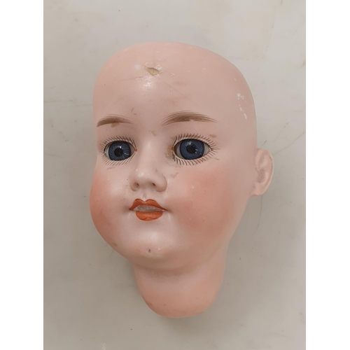 305 - A 1950's Doll, an Armand Marseille 390 Doll's Head with sleepy eyes 2 1/2in D and an Armand Marseill... 