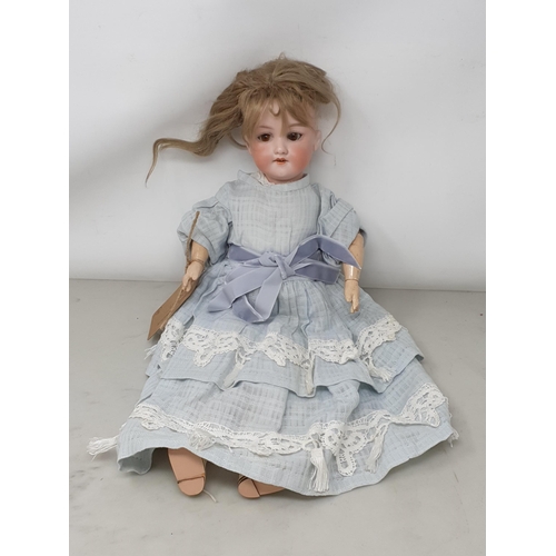 306 - An Armand Marseille 390 Doll with brown eyes, 17in