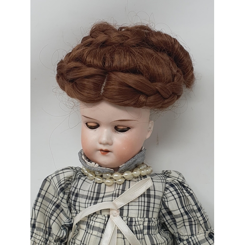 322 - An Armand Marseille 390 bisque headed Doll with sleeping eyes 16in