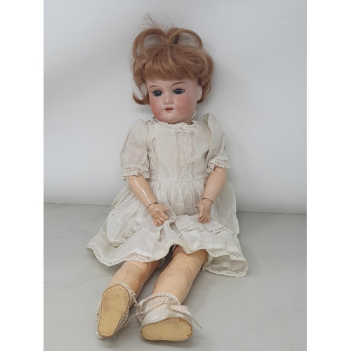 327 - A German bisque headed Doll stamped 390, 17in