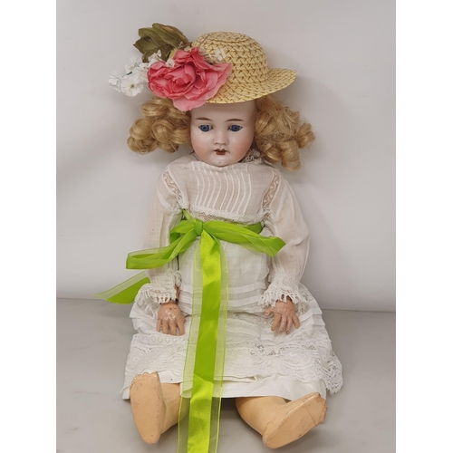 328 - A German bisque headed Doll with fixed blue eyes, 19in