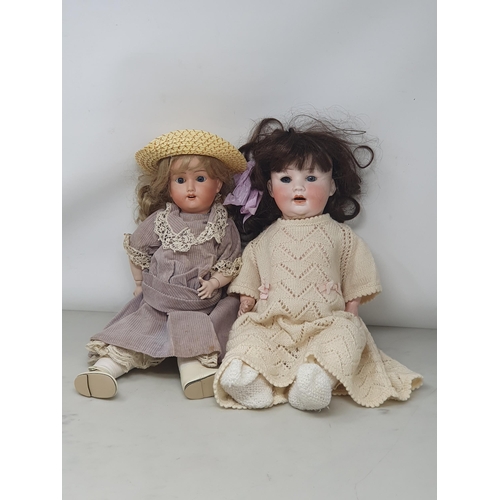 329 - A Schoenau Hoffmeister bisque headed Doll with fixed blue eyes, 16in and a P.M. Baby Doll