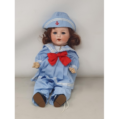 331 - An Armand Marseille 995 bisque headed Doll in sailor's outfit, 16in