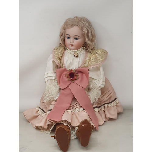 332 - A Gebruder Kuhnlenz bisque headed Doll stamped 133-26, 24in