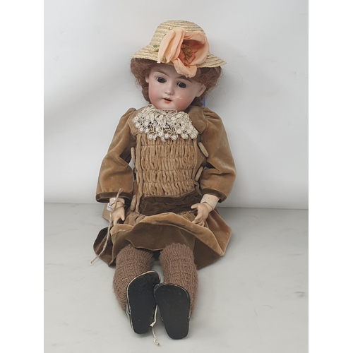 339 - A Gebruder Kuhnlenz bisque headed Doll with sleeping brown eyes marked 133-28, 20in