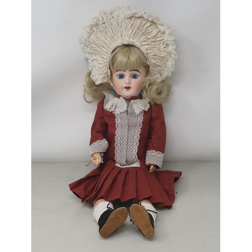 340 - A bisque headed Doll made for the French market with fixed blue eyes, 17in