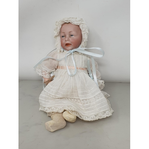 344 - A Keiser bisque headed Baby Doll with antique clothes (possibly original), 11in