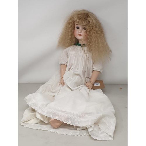 350 - A Pansy 'IV' bisque headed Doll with sleeping eyes, 25in (finger and thumb missing)