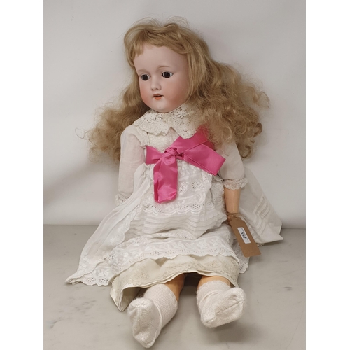 352 - An Armand Marseille 390 bisque headed Doll with fixed brown eyes, 30in