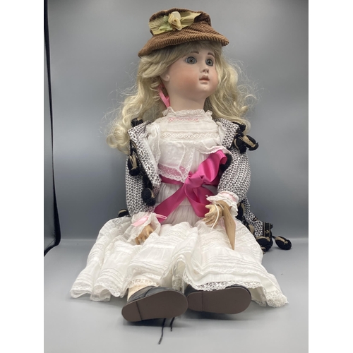 355 - A bisque headed Girl Doll with fixed green eyes stamped A19, Paris, 26in