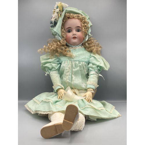 361 - A C.M. Bergmann bisque headed Doll with sleeping blue eyes, stamped BBII, 24in