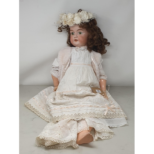 362 - An Armand Marseille bisque headed Doll with fixed green eyes stamped A13M, 28in H (repair to neck)