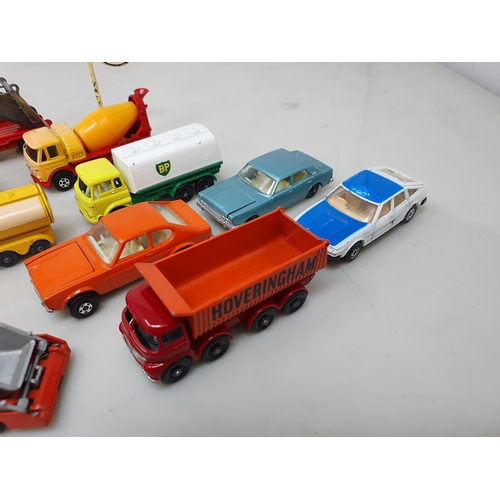 379 - Fifteen Husky and Matchbox Vehicles and a diecast Esso Sign