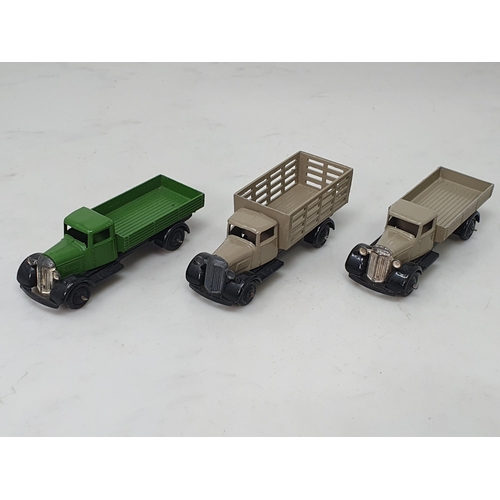 390 - An unboxed Dinky Toys 25/4 stone coloured Market Garden Wagon, 25a/4 stone coloured Wagon and a 25a/... 