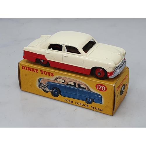 427 - A boxed Dinky Toys No.170 low line red and cream Ford Fordor Sedan