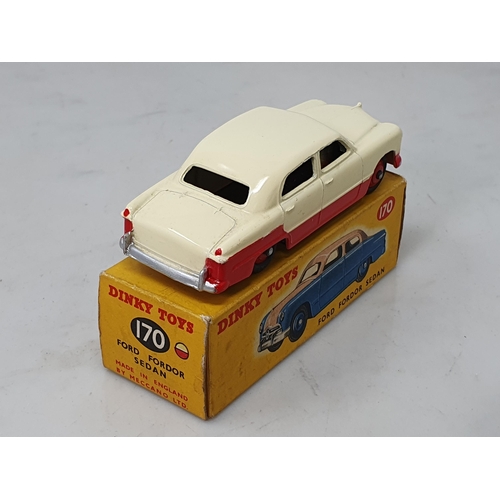 427 - A boxed Dinky Toys No.170 low line red and cream Ford Fordor Sedan