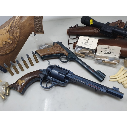 431 - Two Topper Johnny Eagle Pistols in holster, a Topper Luger and a Rifle with scope and accessories