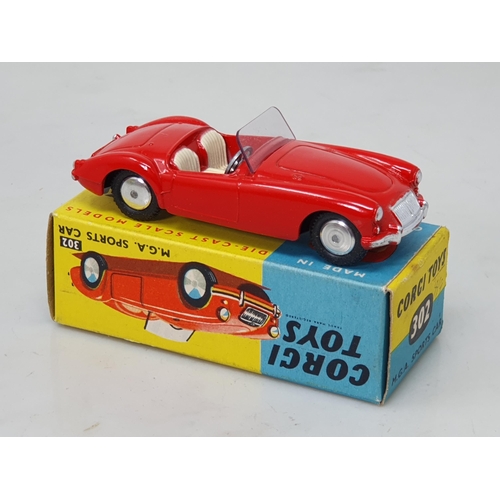 467 - A boxed Corgi Toys No.302 red MGA Sports Car with smooth hubs