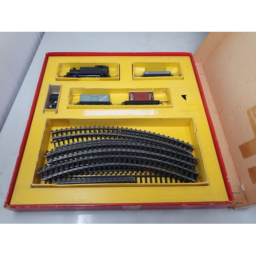 480 - A boxed Triang TT gauge T.4 part Goods Set, a boxed T.32 Island Platform Set, a rake of four unboxed... 