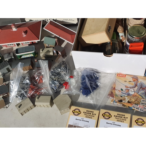 492 - A box of 00 gauge Lineside Buildings, Apparatus, Humbrol Paints, Airfix Figures, Ratio and Peco Barr... 