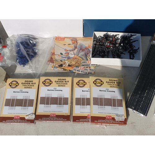 492 - A box of 00 gauge Lineside Buildings, Apparatus, Humbrol Paints, Airfix Figures, Ratio and Peco Barr... 